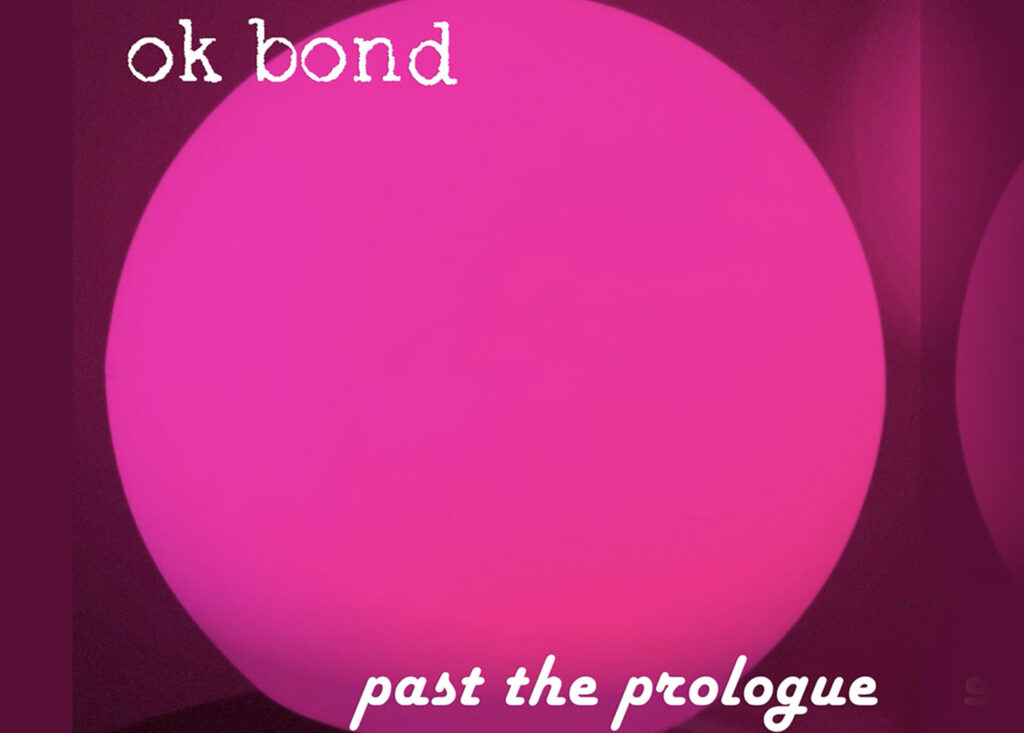 Ein Pinker Kreis mit der Hippie Schrift ''OK Bond - past the prologue''